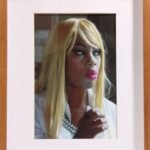 White face and blonde hair